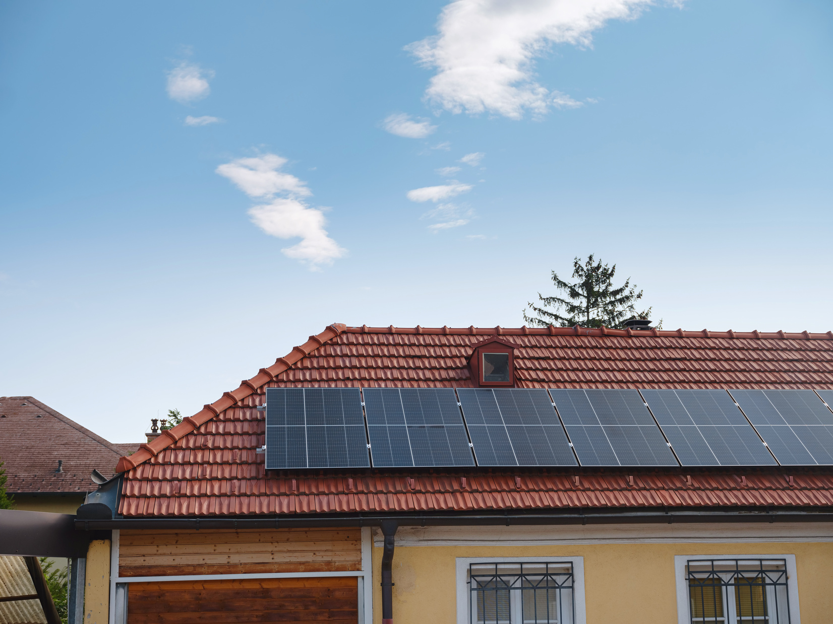 Solar photovoltaic panels on house roof